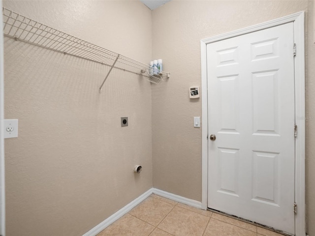 11212 Laurel Brook Ct, Riverview, FL 33569 - laundry area featuring electric dryer hookup and light tile patterned floors
