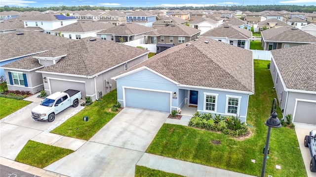 35428 Crescent Creek Dr, Zephyrhills, FL 33541 - view of front of property with an attached garage, a residential view, concrete driveway, stucco siding, and a shingled roof