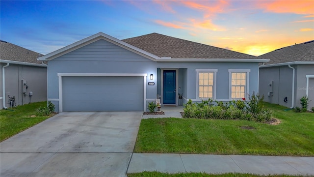 35428 Crescent Creek Dr, Zephyrhills, FL 33541 - single story home with stucco siding, an attached garage, a lawn, concrete driveway, and roof with shingles