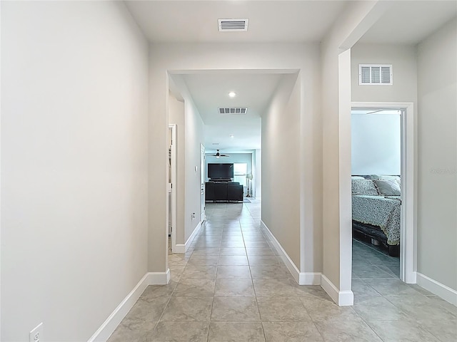 35428 Crescent Creek Dr, Zephyrhills, FL 33541 - corridor featuring light tile patterned floors and recessed lighting