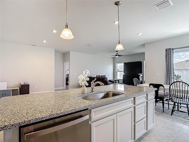 35428 Crescent Creek Dr, Zephyrhills, FL 33541 - kitchen featuring stainless steel dishwasher, ceiling fan, plenty of natural light, open floor plan, and recessed lighting