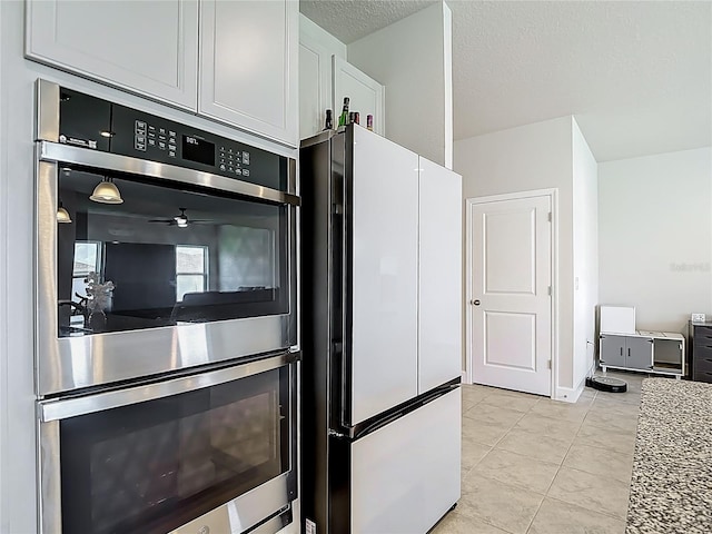 35428 Crescent Creek Dr, Zephyrhills, FL 33541 - kitchen with freestanding refrigerator, double oven, and ceiling fan