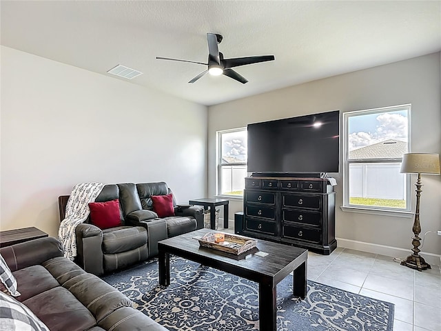 35428 Crescent Creek Dr, Zephyrhills, FL 33541 - living area with ceiling fan and light tile patterned flooring