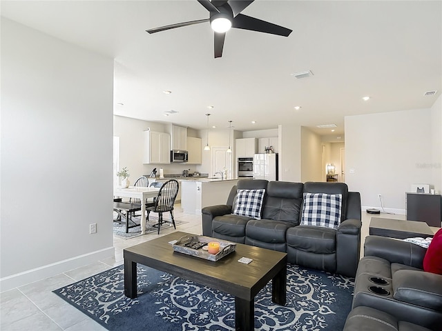 35428 Crescent Creek Dr, Zephyrhills, FL 33541 - living room with a ceiling fan and light tile patterned floors