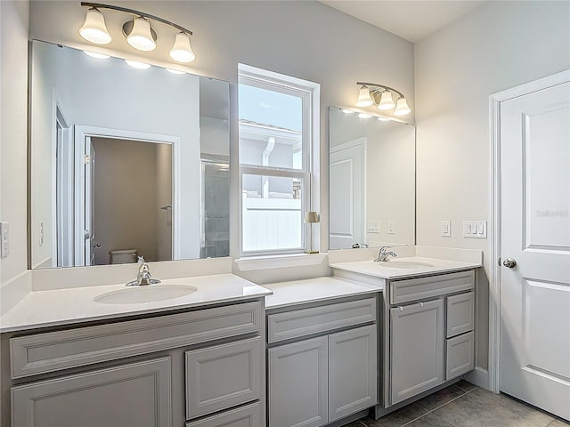 35428 Crescent Creek Dr, Zephyrhills, FL 33541 - full bath featuring double vanity, a shower with shower door, and tile patterned flooring
