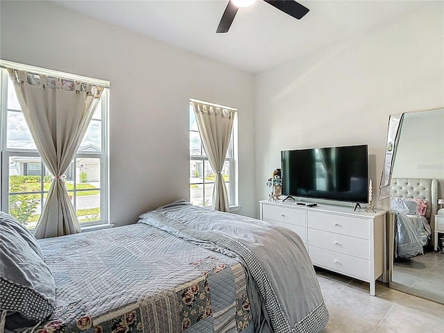 35428 Crescent Creek Dr, Zephyrhills, FL 33541 - bedroom featuring light tile patterned floors and a ceiling fan
