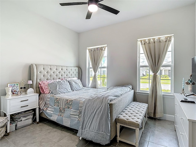 35428 Crescent Creek Dr, Zephyrhills, FL 33541 - bedroom featuring multiple windows, light tile patterned floors, and a ceiling fan