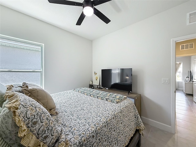 35428 Crescent Creek Dr, Zephyrhills, FL 33541 - bedroom with light tile patterned floors and ceiling fan