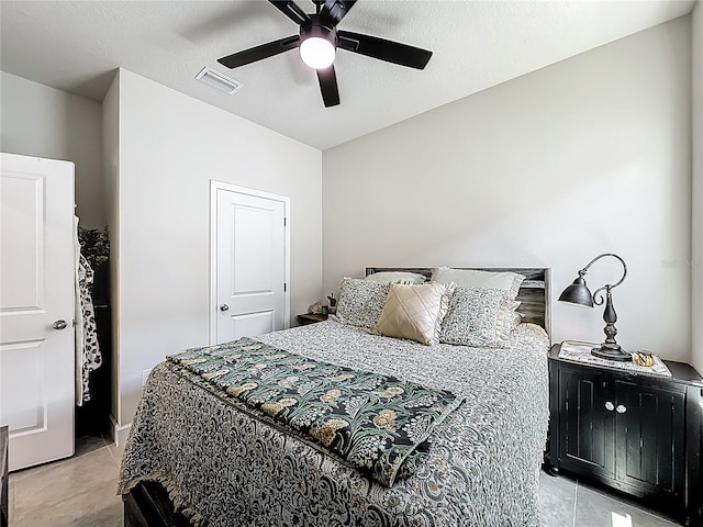 35428 Crescent Creek Dr, Zephyrhills, FL 33541 - bedroom featuring light tile patterned flooring, a ceiling fan, and a textured ceiling