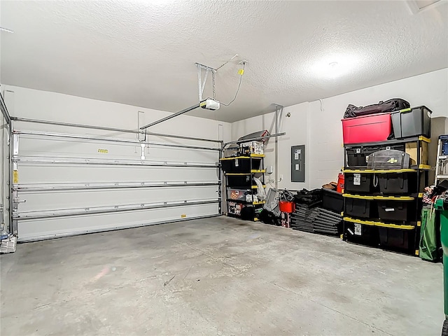 35428 Crescent Creek Dr, Zephyrhills, FL 33541 - garage featuring electric panel and a garage door opener