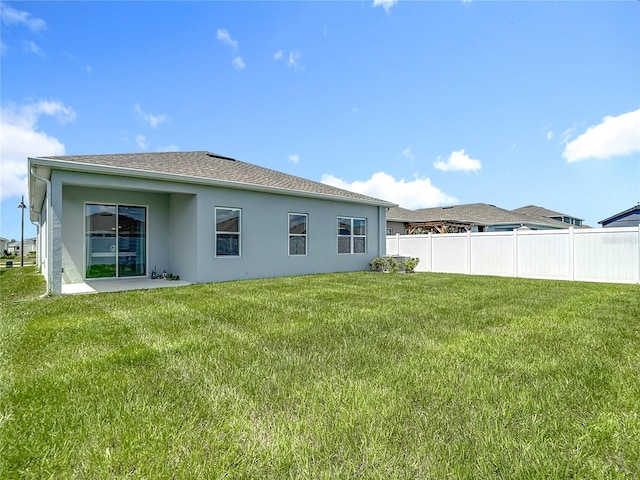 35428 Crescent Creek Dr, Zephyrhills, FL 33541 - rear view of property with stucco siding