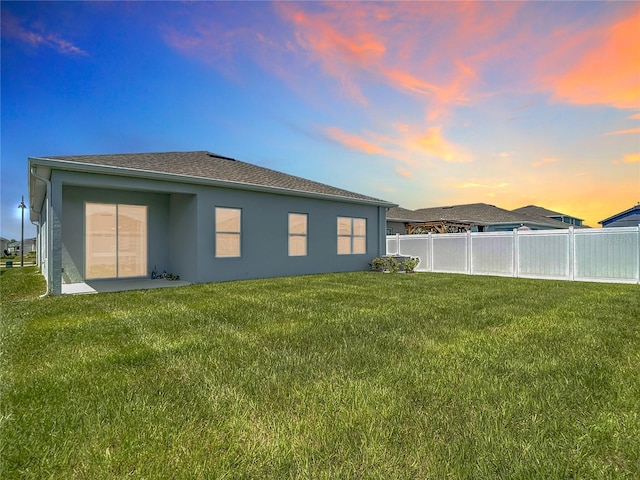 35428 Crescent Creek Dr, Zephyrhills, FL 33541 - back of property with stucco siding and roof with shingles