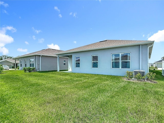 35428 Crescent Creek Dr, Zephyrhills, FL 33541 - back of property featuring stucco siding and a yard