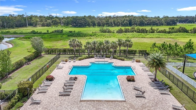 35428 Crescent Creek Dr, Zephyrhills, FL 33541 - community pool featuring a water view, view of scattered trees, and a patio area