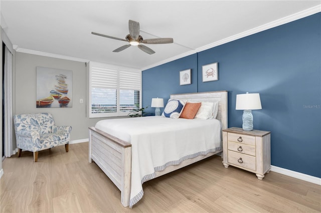 9495 Blind Pass Rd Unit 1103, St Pete Beach, FL 33706 - bedroom featuring ornamental molding, light wood-style flooring, and a ceiling fan