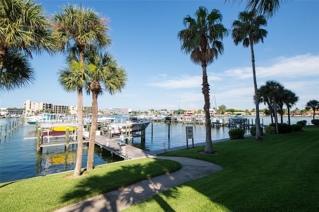 9495 Blind Pass Rd Unit 1103, St Pete Beach, FL 33706 - dock featuring a water view and a yard