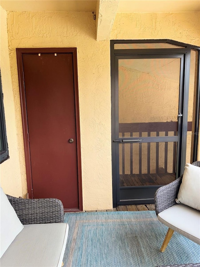 1550 S Belcher Rd Unit 335, Clearwater, FL 33764 - doorway to property featuring stucco siding