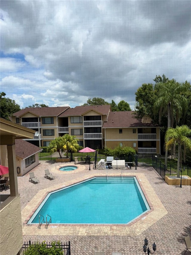 1550 S Belcher Rd Unit 335, Clearwater, FL 33764 - community pool with a hot tub and a patio area