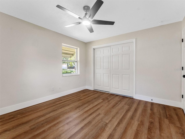 1024 San Marco Dr, Largo, FL 33770 - unfurnished bedroom with wood finished floors, a closet, and ceiling fan