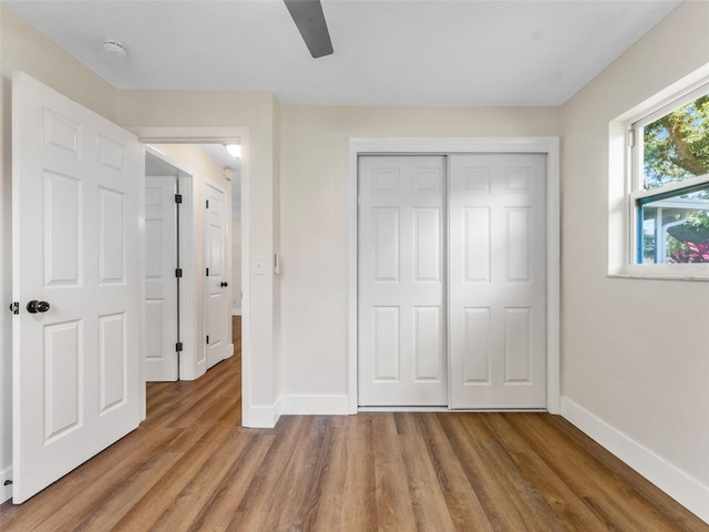 1024 San Marco Dr, Largo, FL 33770 - unfurnished bedroom featuring wood finished floors, a closet, and a ceiling fan