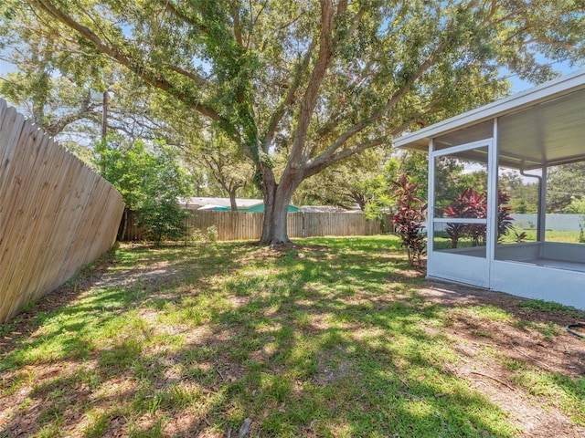 1024 San Marco Dr, Largo, FL 33770 - fenced backyard with a sunroom