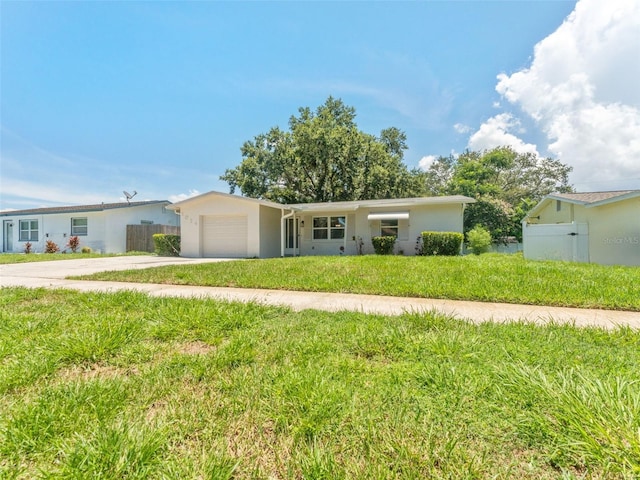 1024 San Marco Dr, Largo, FL 33770 - ranch-style house with a garage, concrete driveway, and stucco siding
