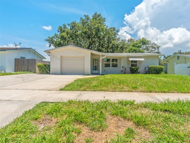 1024 San Marco Dr, Largo, FL 33770 - single story home featuring a garage, concrete driveway, and stucco siding