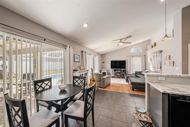 3509 Williston Loop, Land O Lakes, FL 34639 - dining area with a ceiling fan, vaulted ceiling, dark tile patterned flooring, a textured ceiling, and recessed lighting