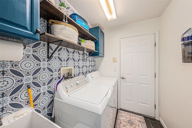3509 Williston Loop, Land O Lakes, FL 34639 - laundry room with cabinet space, washing machine and dryer, a textured ceiling, and tile patterned floors