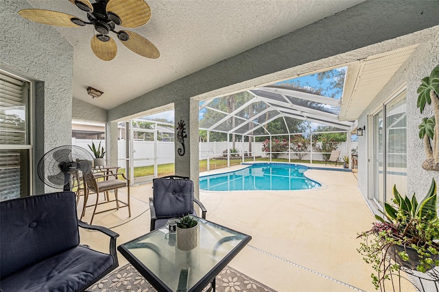 3509 Williston Loop, Land O Lakes, FL 34639 - view of pool featuring a fenced backyard, a patio area, glass enclosure, and a ceiling fan