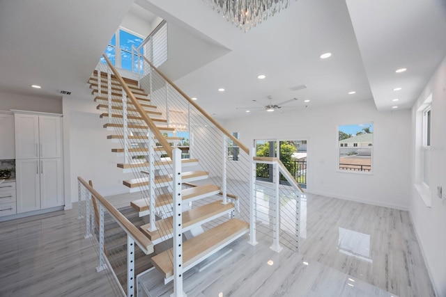 18077 3rd St E, Redington Shores, FL 33708 - staircase with recessed lighting, wood finished floors, and a ceiling fan