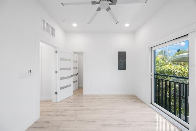 18077 3rd St E, Redington Shores, FL 33708 - spare room with light wood-style floors, a ceiling fan, electric panel, and recessed lighting