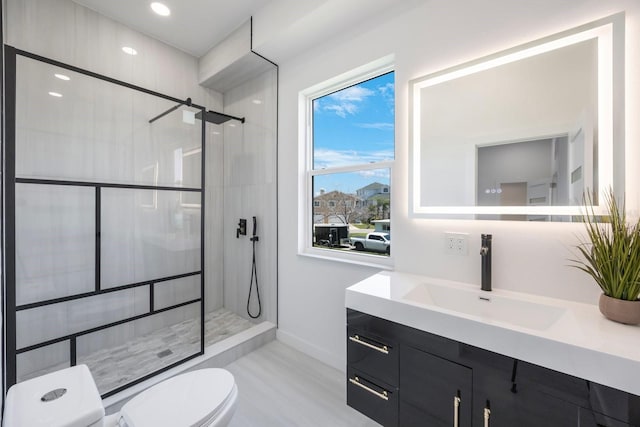 18077 3rd St E, Redington Shores, FL 33708 - full bath featuring vanity, tiled shower, and wood finished floors