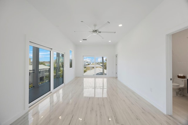 18077 3rd St E, Redington Shores, FL 33708 - empty room with healthy amount of natural light, recessed lighting, light wood finished floors, and ceiling fan