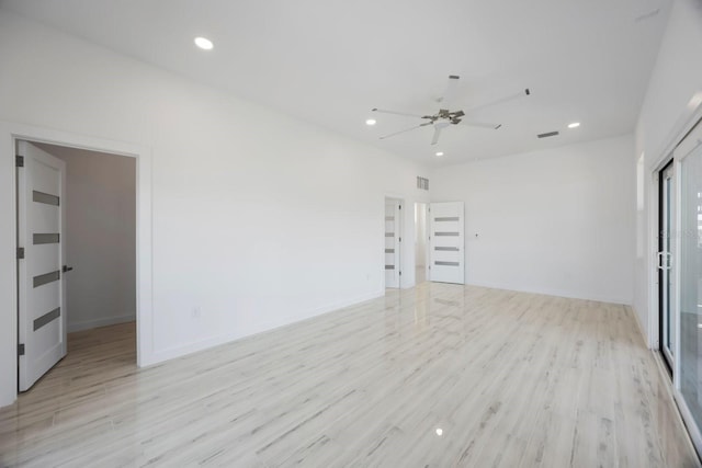 18077 3rd St E, Redington Shores, FL 33708 - unfurnished room with light wood-style floors, a ceiling fan, and recessed lighting