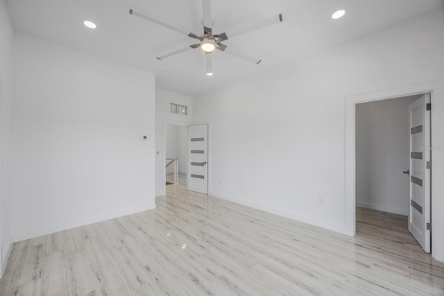 18077 3rd St E, Redington Shores, FL 33708 - spare room featuring wood finished floors, a ceiling fan, and recessed lighting