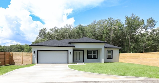 2522 W Castle Rd, Dunnellon, FL 34434 - view of front facade featuring stucco siding, a garage, roof with shingles, and driveway
