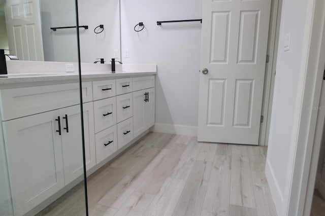 2522 W Castle Rd, Dunnellon, FL 34434 - bathroom with double vanity and wood finished floors