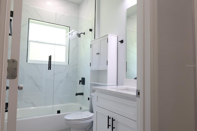 2522 W Castle Rd, Dunnellon, FL 34434 - bathroom featuring vanity and bath / shower combo with glass door