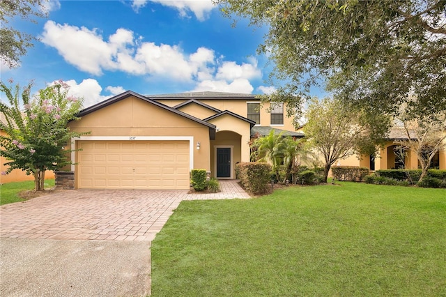 1037 Cypress Pointe Blvd, Davenport, FL 33896 - traditional-style home featuring decorative driveway, stucco siding, a front lawn, and an attached garage