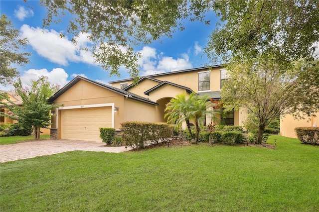 1037 Cypress Pointe Blvd, Davenport, FL 33896 - traditional-style house featuring a garage, stucco siding, a front yard, and driveway