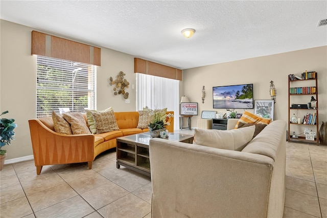 1037 Cypress Pointe Blvd, Davenport, FL 33896 - living area with light tile patterned floors and a textured ceiling
