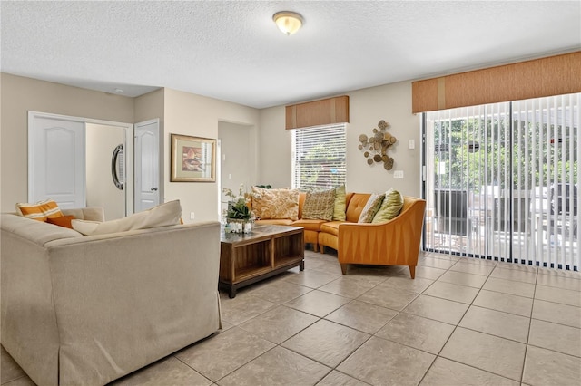 1037 Cypress Pointe Blvd, Davenport, FL 33896 - living area with light tile patterned flooring and a textured ceiling