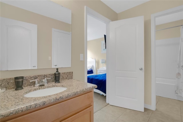 1037 Cypress Pointe Blvd, Davenport, FL 33896 - bathroom with tile patterned floors, vanity, and connected bathroom