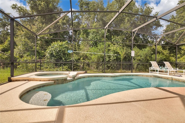 1037 Cypress Pointe Blvd, Davenport, FL 33896 - view of swimming pool featuring a patio, a pool with connected hot tub, and a lanai