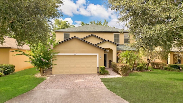 1037 Cypress Pointe Blvd, Davenport, FL 33896 - traditional-style house featuring a front yard, driveway, stucco siding, and a garage