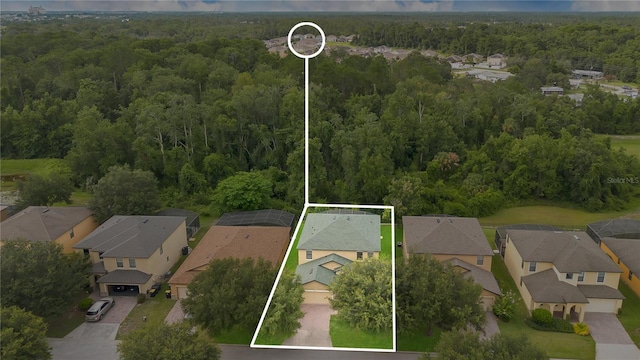 1037 Cypress Pointe Blvd, Davenport, FL 33896 - aerial view of residential area with a forest and property parcel outlined