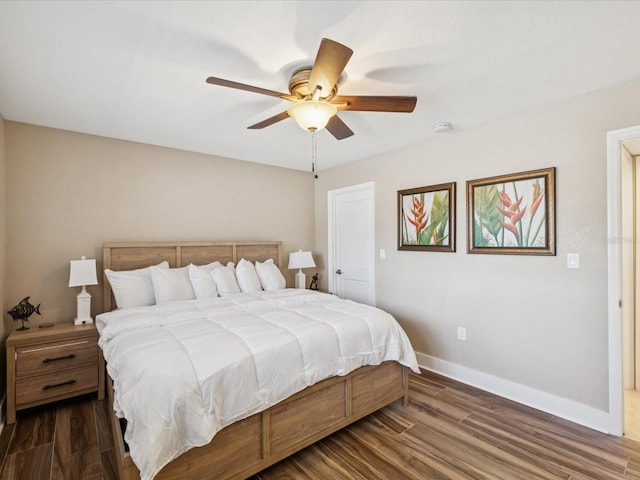 10265 Gulf Blvd Unit A107, Saint Petersburg, FL 33706 - bedroom with dark wood-type flooring and ceiling fan