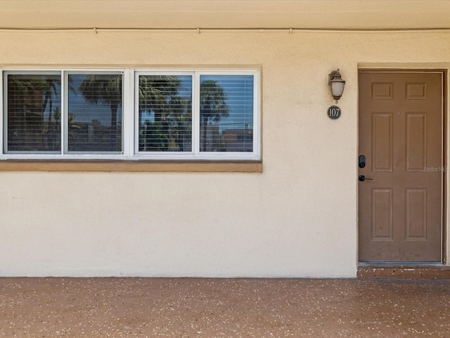 10265 Gulf Blvd Unit A107, Saint Petersburg, FL 33706 - view of exterior entry with stucco siding