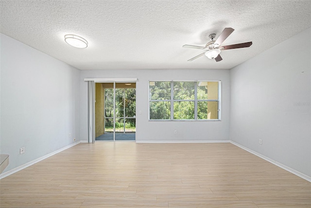 8118 Stone Path Way, Tampa, FL 33647 - empty room with light wood-style floors, a textured ceiling, and a ceiling fan